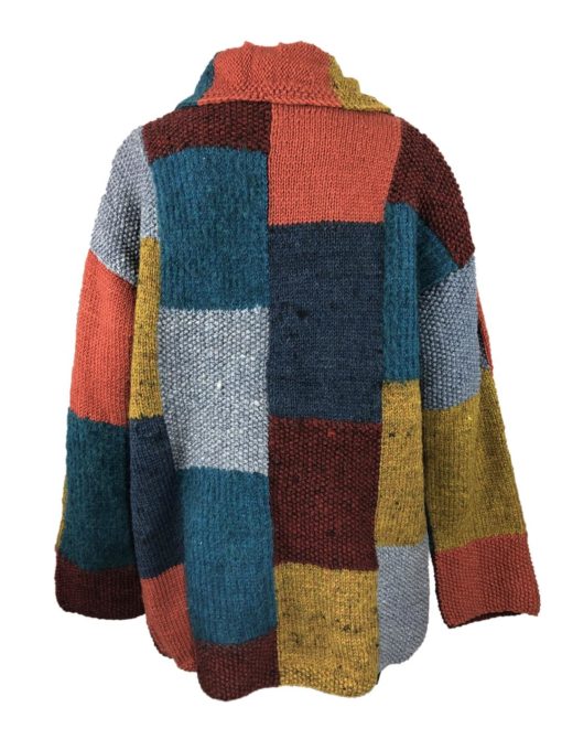 Übergroße , gemütliche  Wickelweste mit großen Taschen. Hochwertige Wolle, handgestrickt in der Sierra Ecuadors. Weiche Farben verschmelzen zu einem anschmiegsamen Traum.